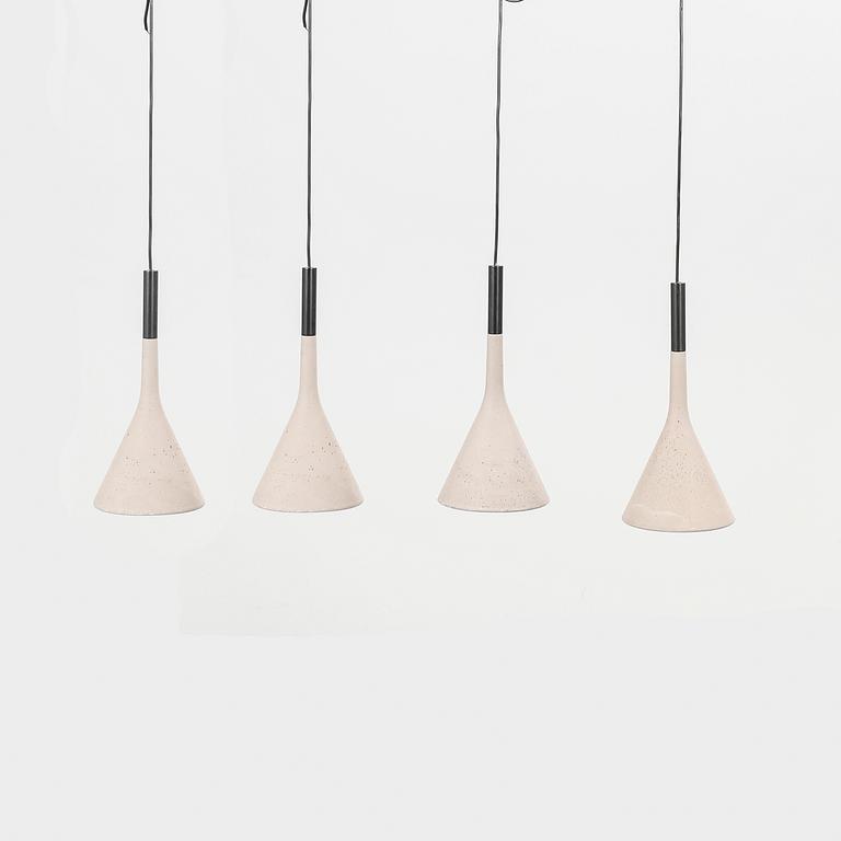 A set of four Aplomb mini" concrete ceiling pendants from Lucidi & Pever.