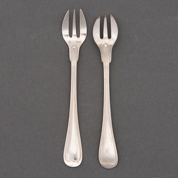A SET OF 12 OYSTER FORKS, plate. Miele & Co.