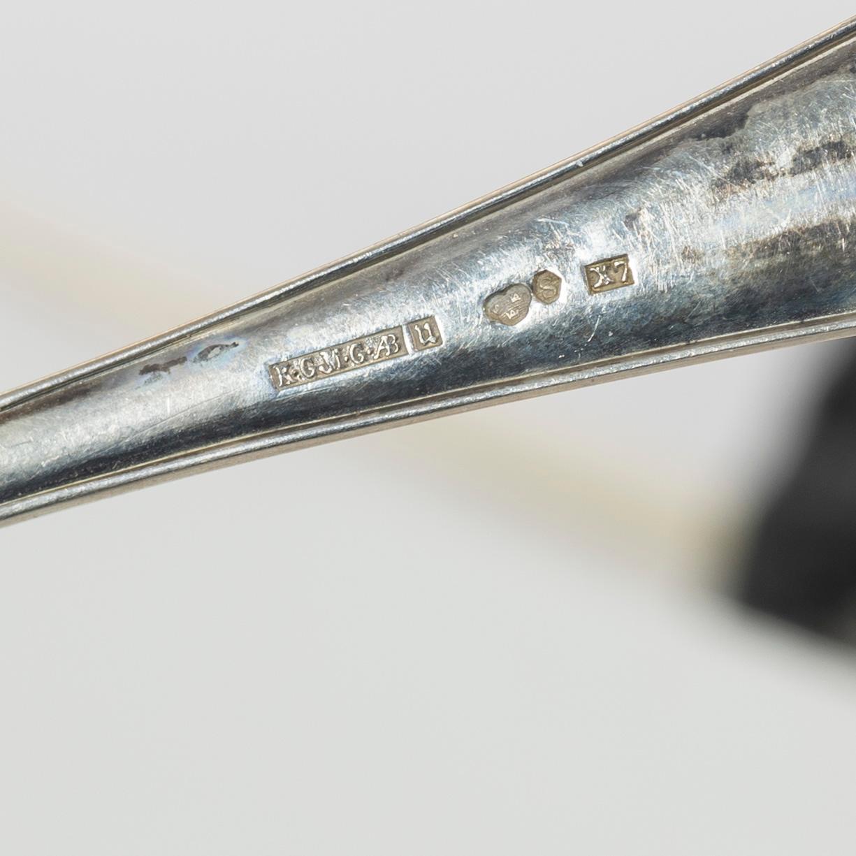 A set of silver cutlery and napkin rings, including with mark of Th Marthinsen, Tönsberg, Norway (14 pieces).