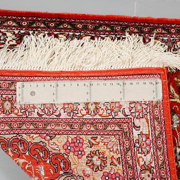A Ghom rug, silk, 145 x 49 cm.