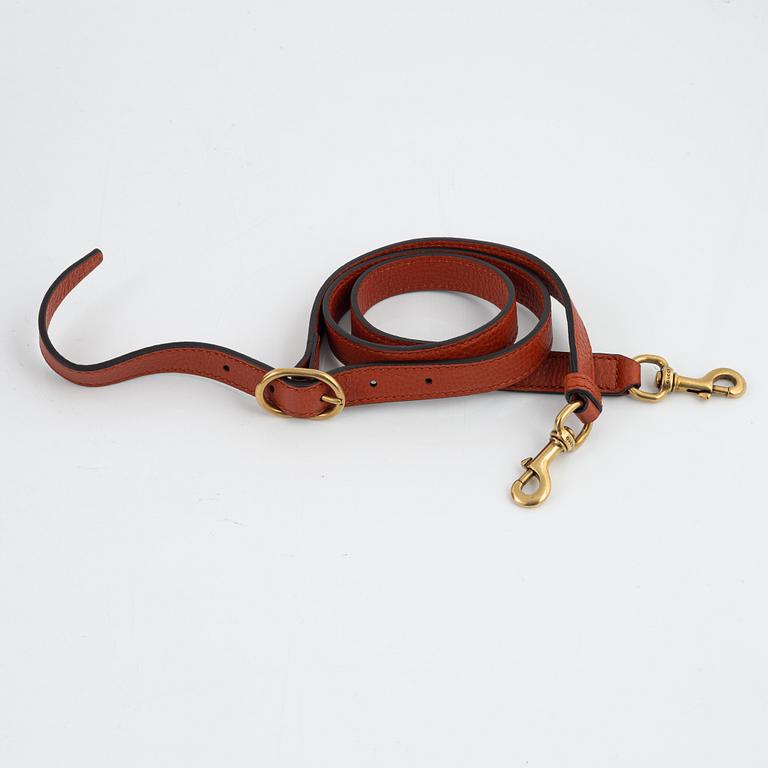 Gucci, a leather handbag.