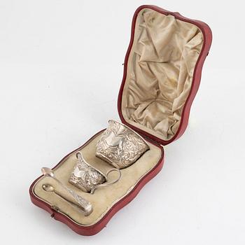 A silver sugar bowl with thongs and a creamer, in original box, Mappin & Webb, London, England, 1900-1901.