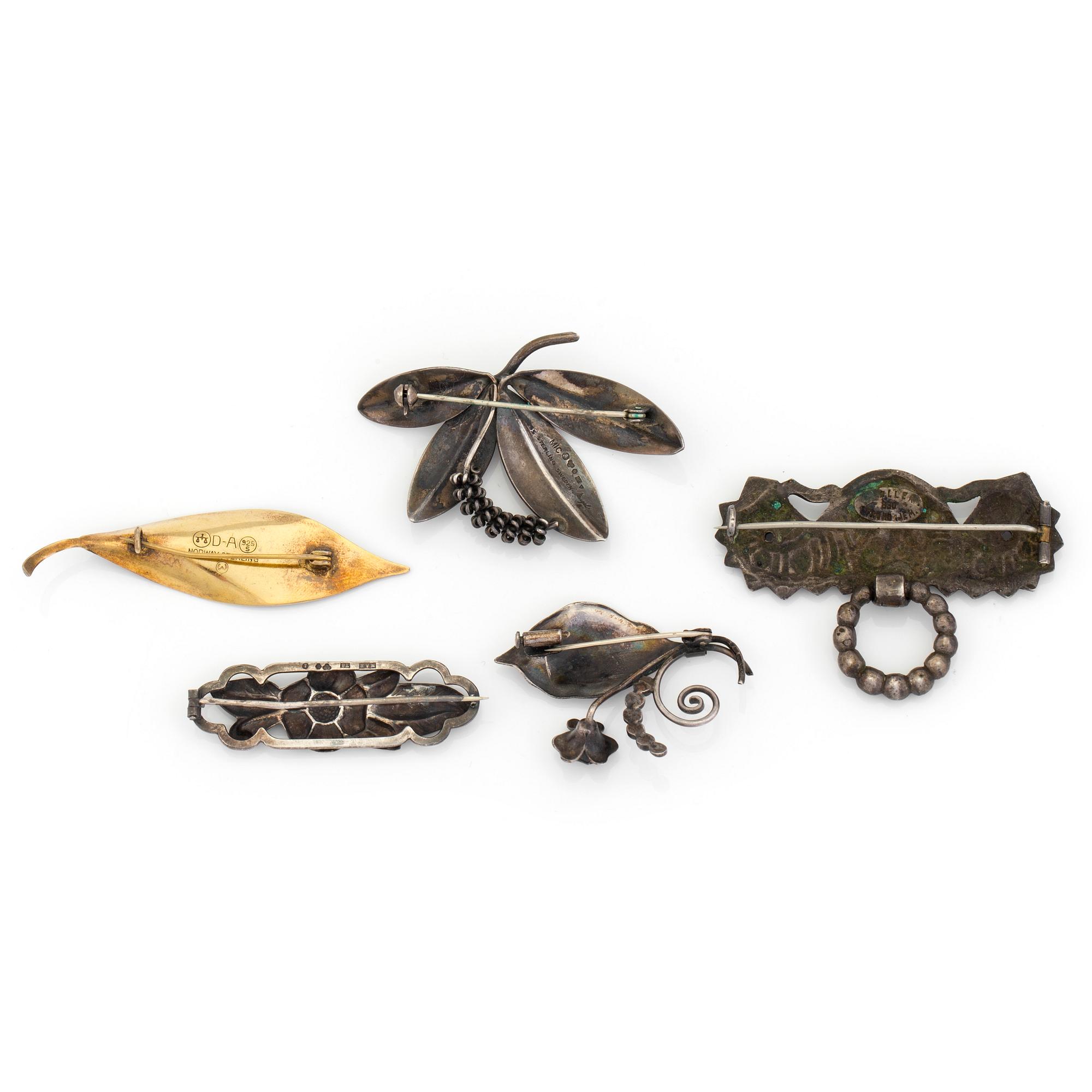 Five silver brooches including one by David Andersen, Norway.