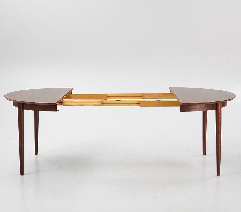 Niles Otto Møller, a rosewood veneered table with four chairs, JL Møller, Denmark, 1950's/60's.