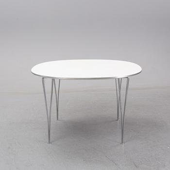 A 'Supercircle table by Bbruno Marthsson & Piet Hein for Fritz Hansen, dated 2000.
