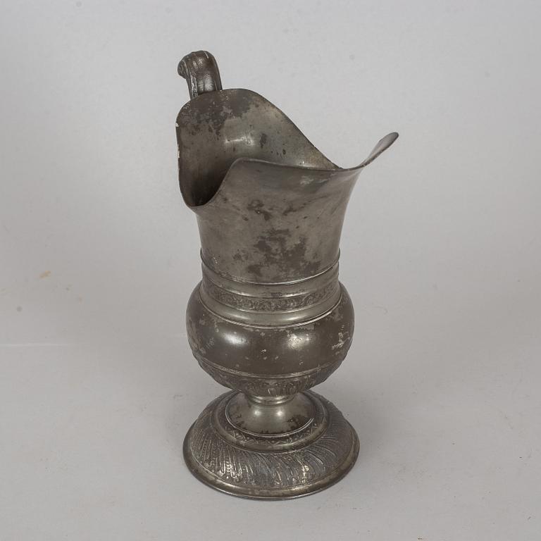 A pewter jug, probably 17th century.