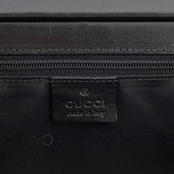 Gucci, a nylon handbag.