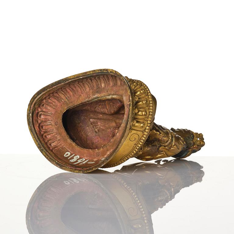 A gilt copper alloy figure of Amitayus, Tibet, 17th/18th century.