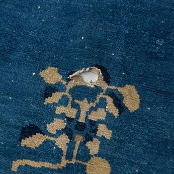 An antique Chinese carpet, c. 355 x 270 cm.