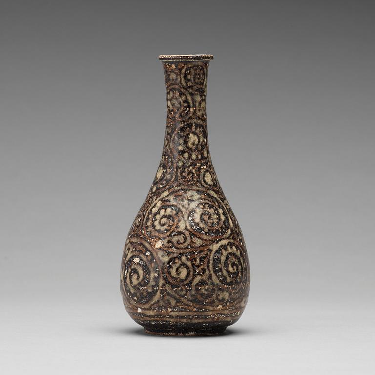 A black glazed sgrafitto vase, presumably Song dynasty (960-1279).