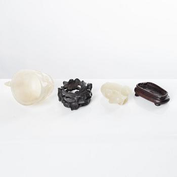 A group of four Chinese sculptured nephrite objects, early 20th Century.