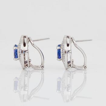 A pair of 3.60 ct tanzanite an brilliant-cut diamond earrings. Total carat weight of diamonds circa 1.60ct.