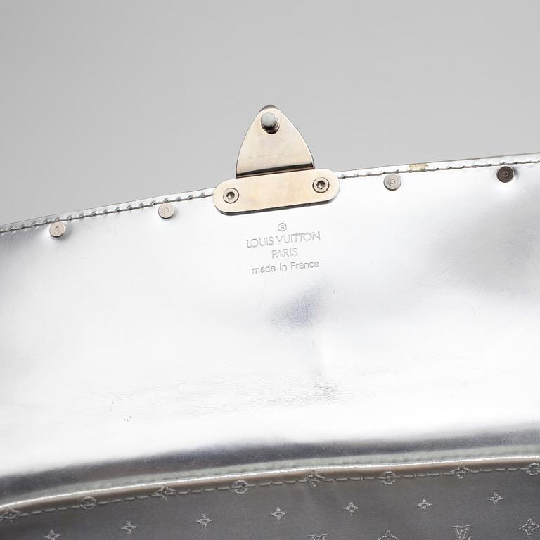 LOUIS VUITTON, a silver coloured leather handbag.