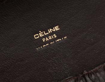 A monogram canvas beautybox by Celine.