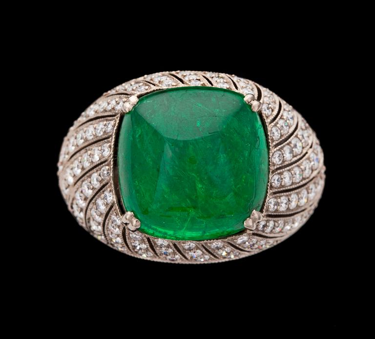 A cabochon cut emerald, 6.84 cts, and diamond ring, tot. 1.20 cts.