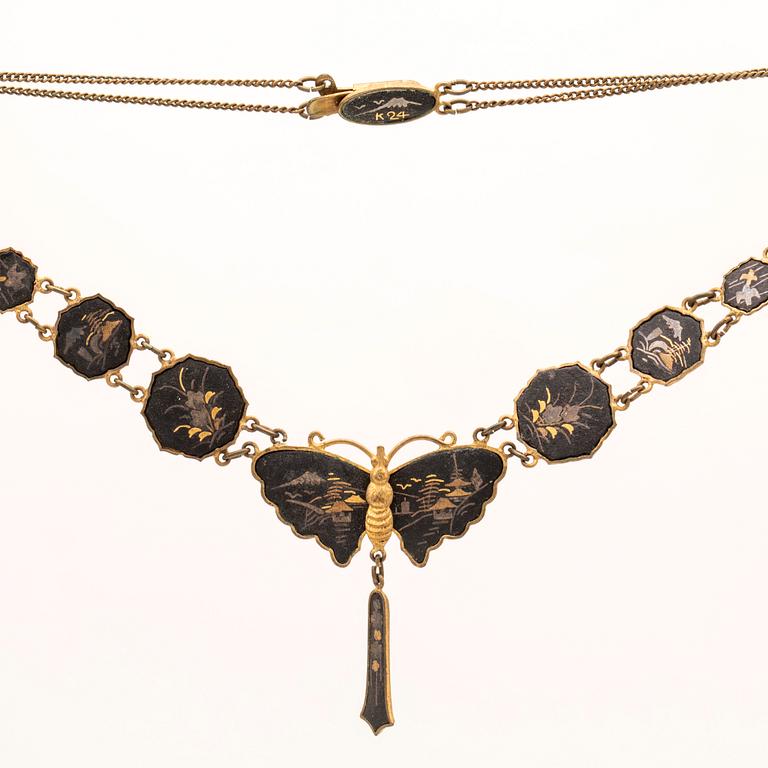 A silver-plated, gilded and lacquered metal parure from Japan, first half of the 20th century.