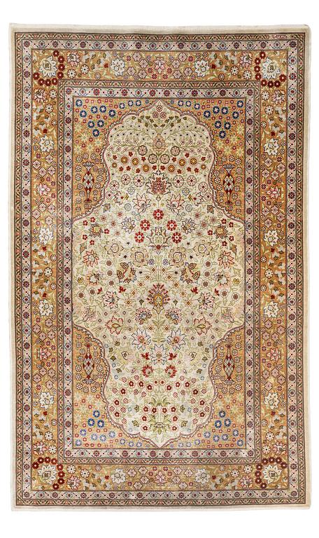 A double-nisch silk Hereke rug, c. 125 x 78 cm.