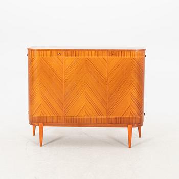 A 1940s teak and mahogany sideboard/cabinet.