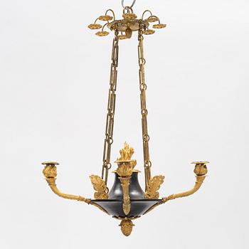 A French Empire ormolu and patinated bronze four-branch chandelier, early 19th century.