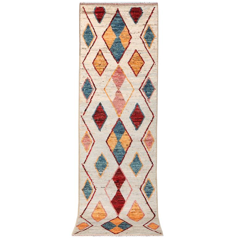 A Moroccan runner carpet, c. 297 x 81 cm.