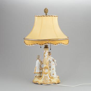 a rococo-style porcelain table lamp from the first half of the 20th century.