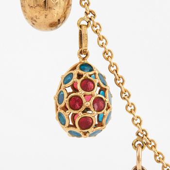 A FABERGÉ  GOLD Chain Necklace WITH 8 GOLD, ENAMEL ETC MINIATURE EASTER EGG PENDANTS, S.T PETERSBURG and 3 other.