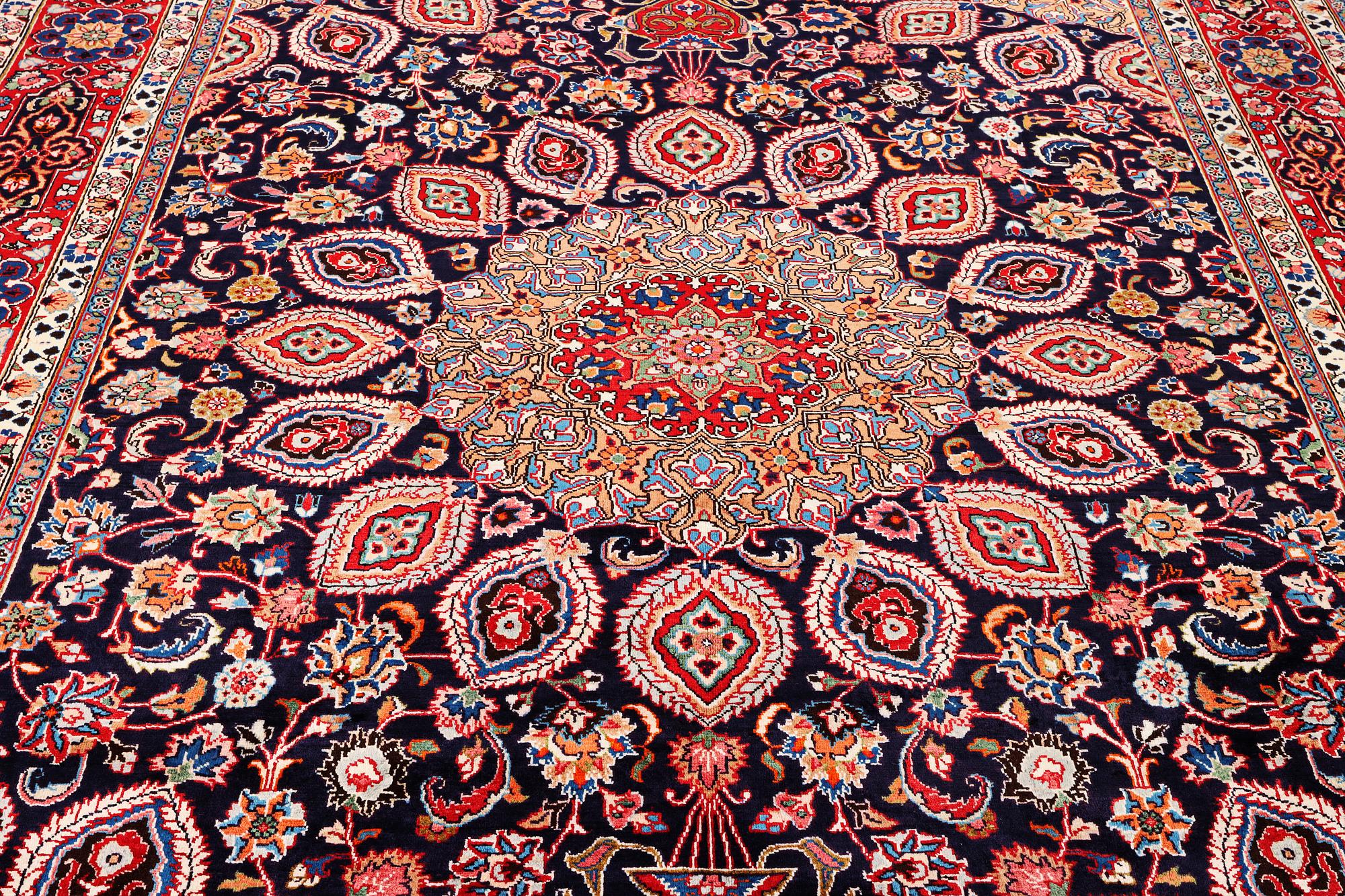 A Meshed carpet, c. 352 x 255 cm.