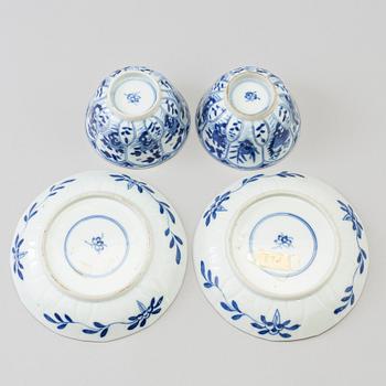 A pair of blue and white porcelain cups with saucers, Qing dynasty, 19th century, in Kangxi style.