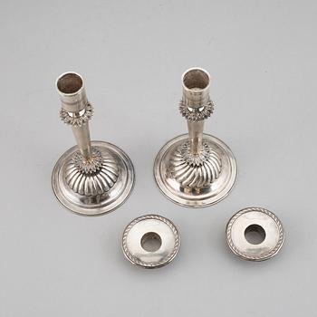 A pair of Empire silver candle sticks, 1823.