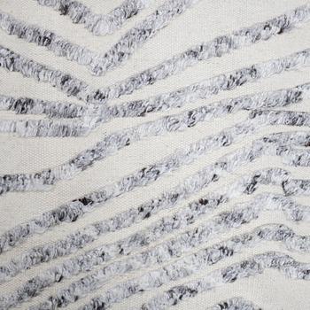 A CARPET, flat weave, with knoted detalis in relief, ca 300 x 240 cm.