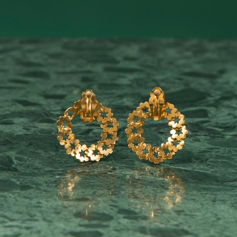 A pair of earrings by CHANEL.