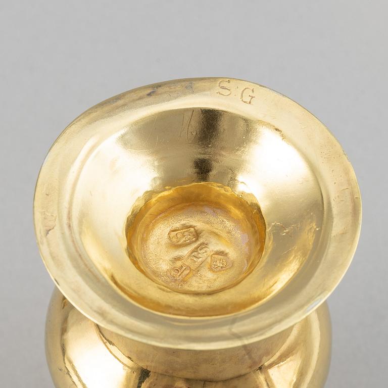 Four English 18th century silver-gilt caster-cruet, one pair marked Thomas Shepherd, 1790, one John Delmester 1760,