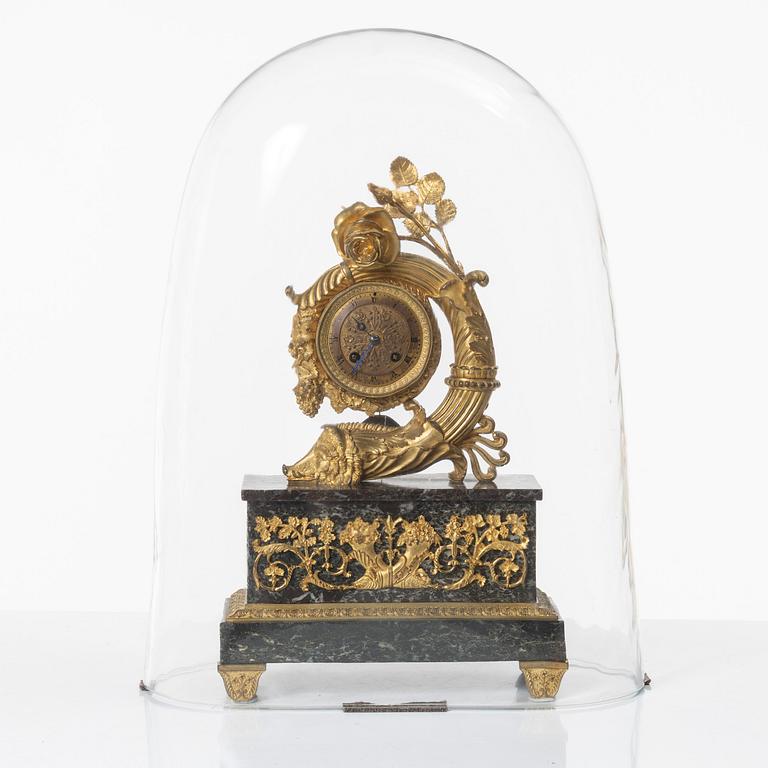 A presumably French Empire-style gilt bronze and marble mantel clock, later part 19th century.