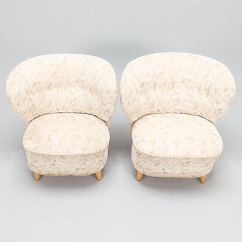 A pair of mid 20th century armchairs.