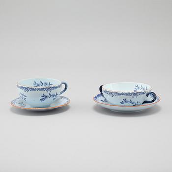 Seven "Ostindia" broth cups with sausers and chocolate cups with sausers in earthenware, Rörstrand, 20th century.