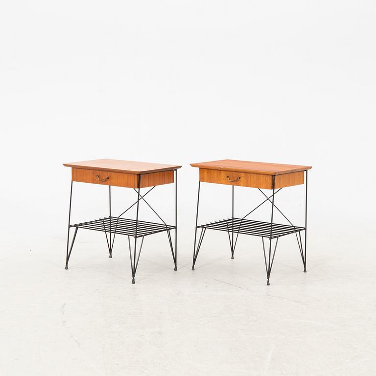 A pair of 1950s teak bedside tables.