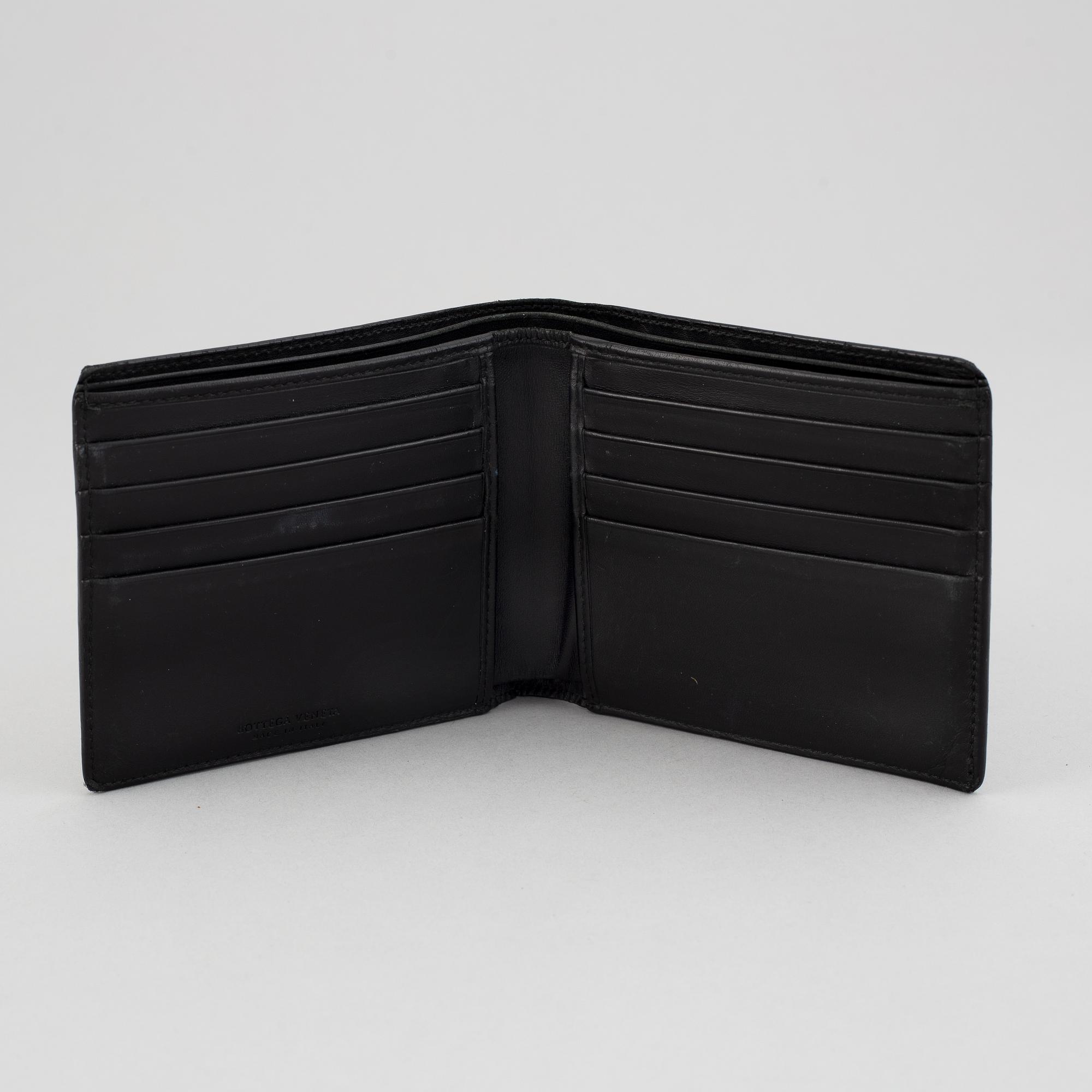 Bottega veneta, a black leather wallet.