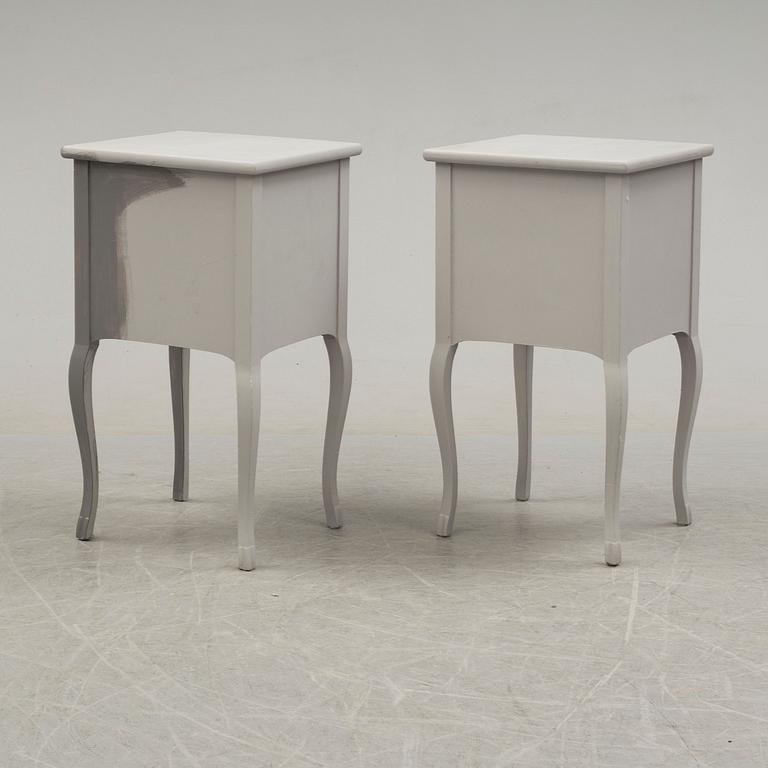 A pair of 20th century Rococo style bed side tables.