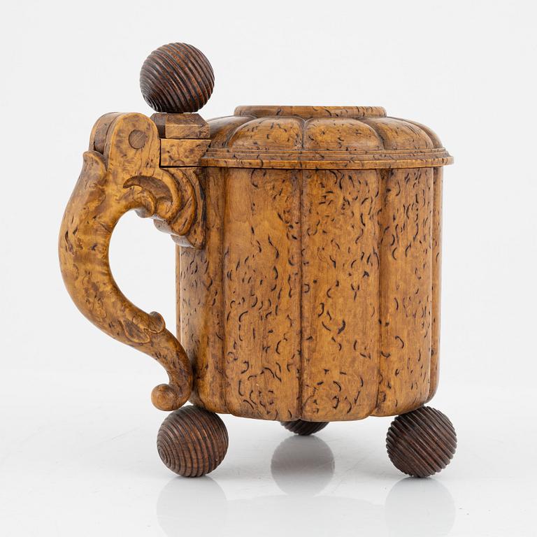 A 19th Century birch Baroque style tankard.