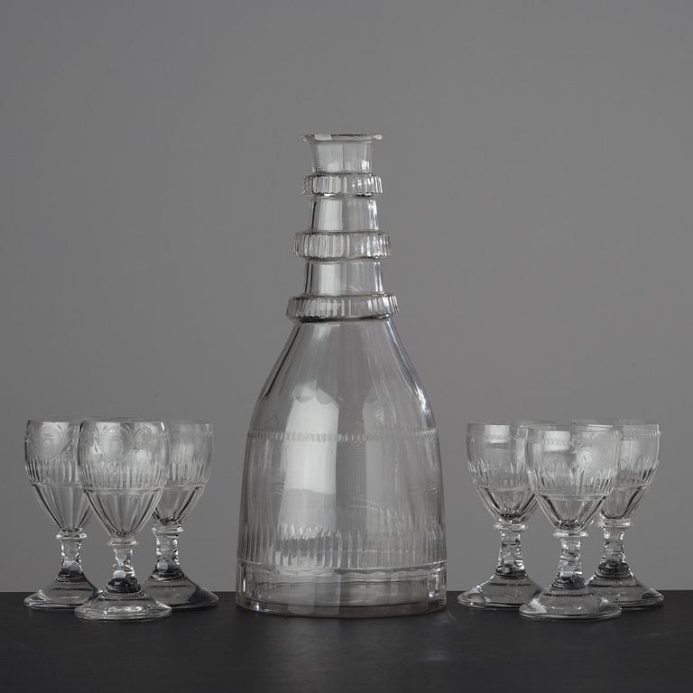 A large bottle and six glasses, Sweden, Reijmyre glassworks, circa 1810. Engraved by Anders Spolander.