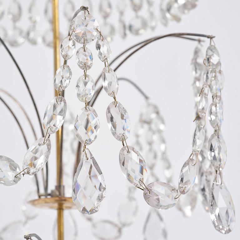 A late Gustavian gilt brass and cut glass eight-branch chandelier, Stockholm, late 18th century.