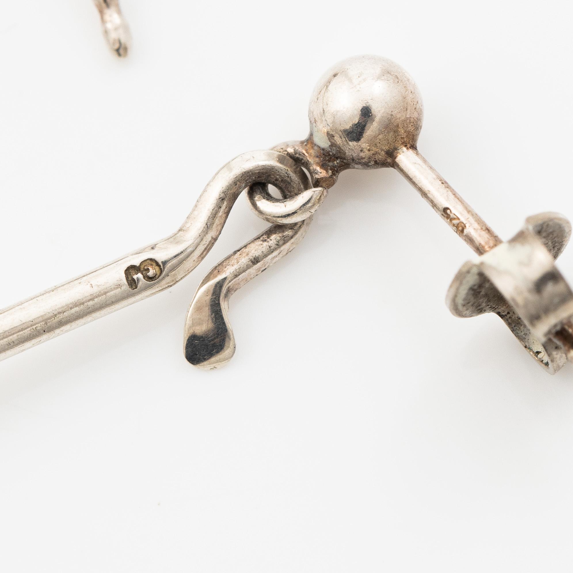 Vivianna Torun Bülow-Hübe, a pair of earrings, silver with green quartz, by Georg Jensen, Denmark.
