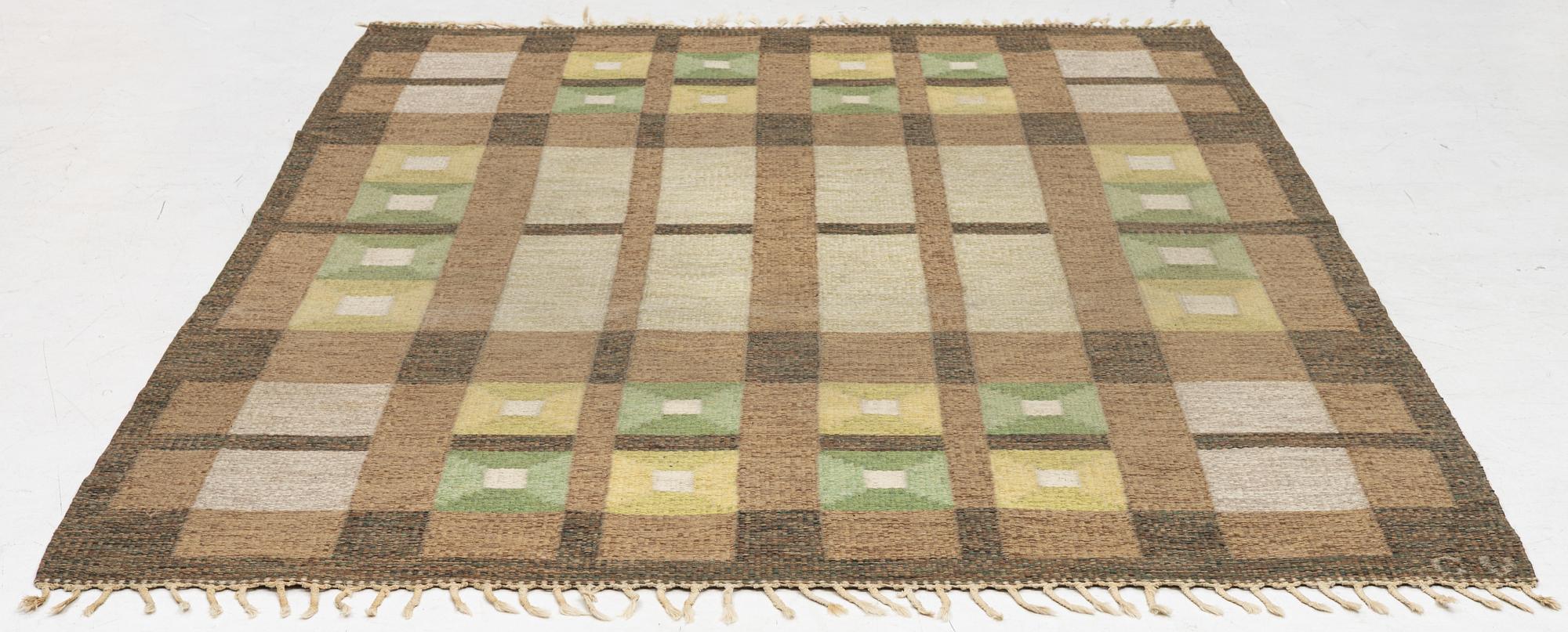 A flat weave carpet, signed, ca. 243 x 165 cm.