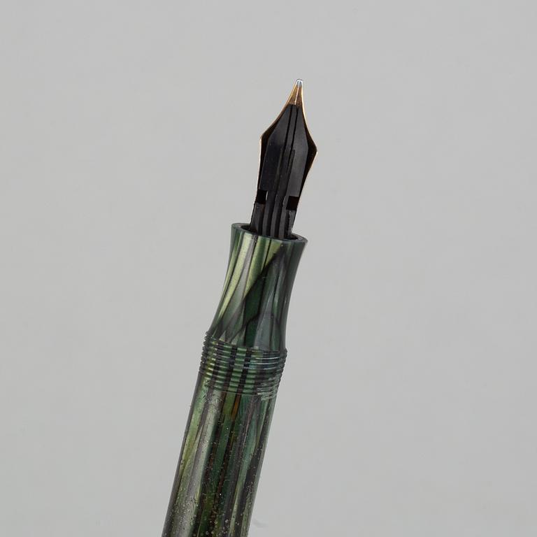 Montblanc, a fountain pen and a pencil in a leather case, 1950's.