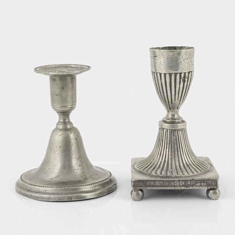 A group of three pewter candlesticks, a salt cellar and four dishes, including Erik Wikgren, Nyköping, (1805-1846).