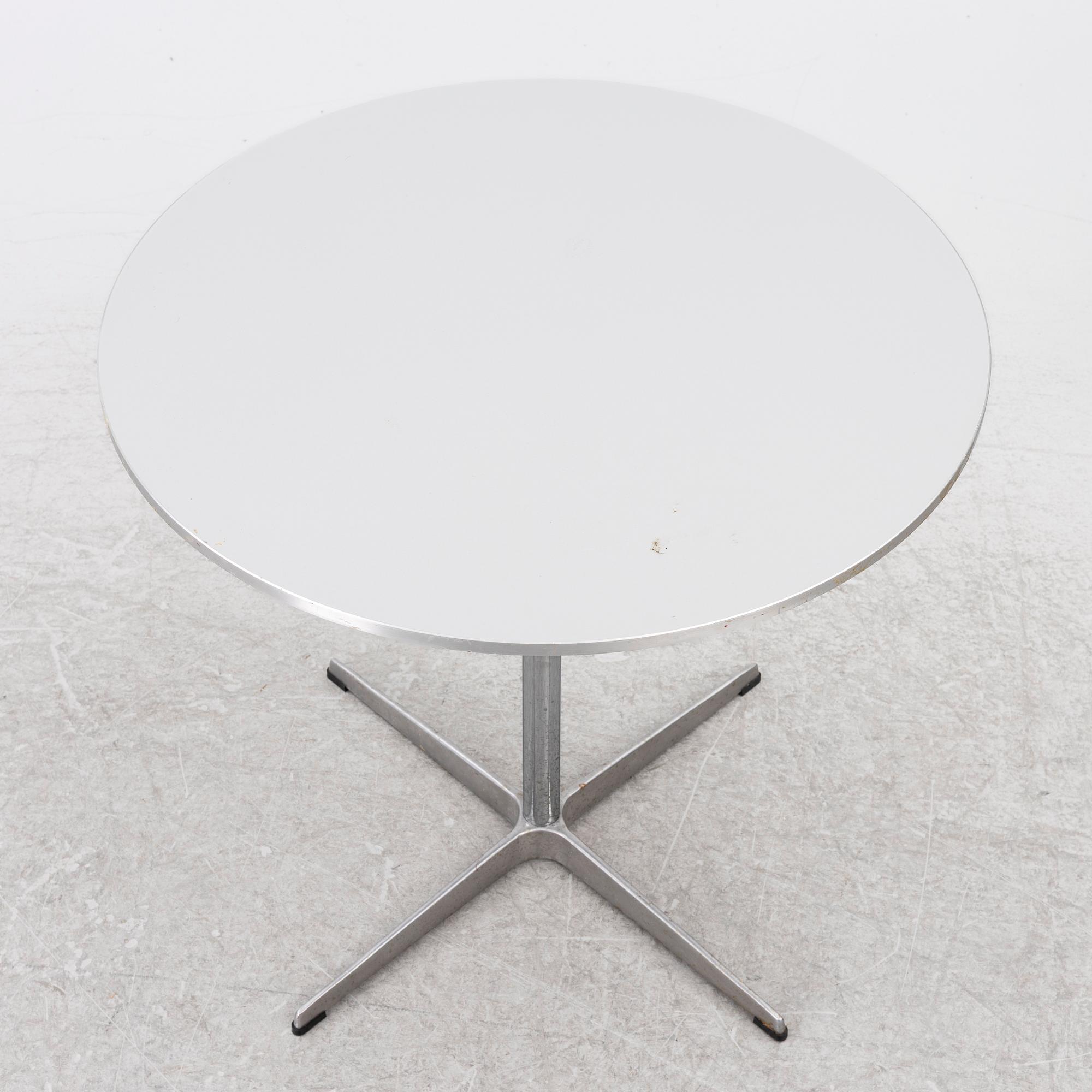 Arne Jacobsen, A coffee table, by Fritz Hansen, dated 2000.