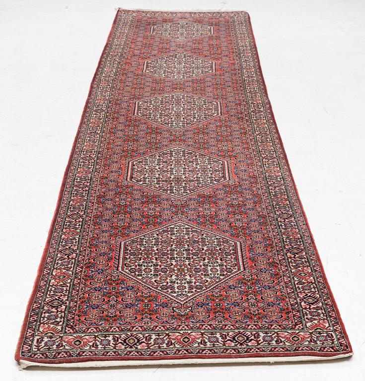 A runner carpet, possibly Birjand, c. 412 x 90 cm.