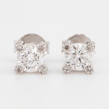 Brilliant-cut diamond stud earrings.