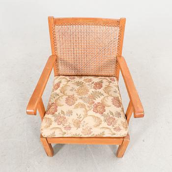 A 1940/50s rattan armchair.