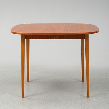 A second half of the 20th Century teak dining table.